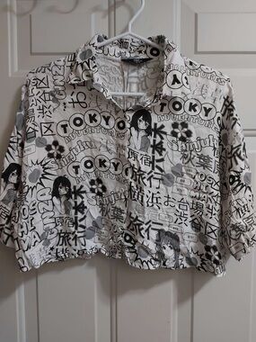 Black and white short sleeve button down crop top with anime print